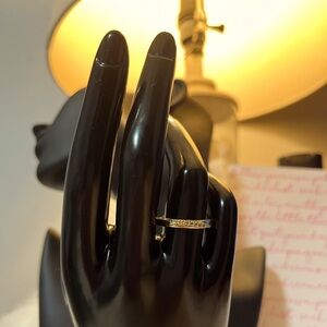 Elegant Gold Ring with Diamond Accents
stainless Steel